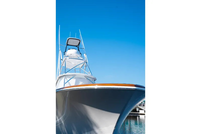 Slide: The Image of 2026 Front Runner 47 W/A boat with sleek design against clear blue sky. - 1