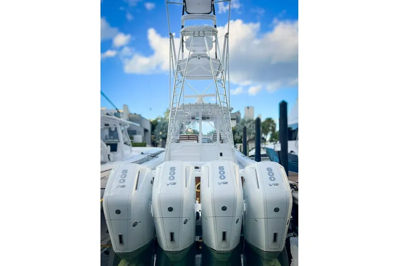 Slide: The Image of 2026 Front Runner 47 W/A boat with four powerful V12 engines docked. - 4