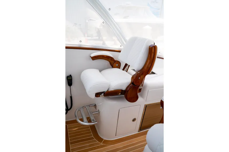 Slide: The Image of Luxurious helm seat on 2026 Front Runner 47 W/A boat with wooden accents. - 8