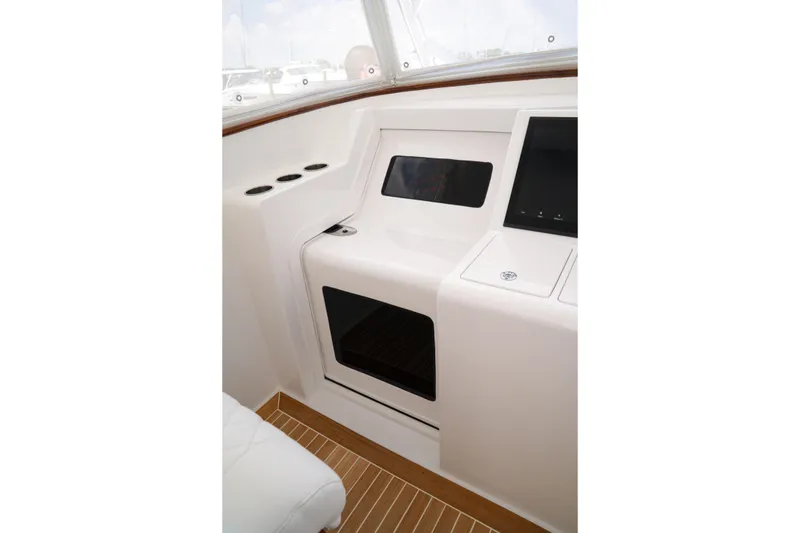 Slide: The Image of Interior of 2026 Front Runner 47 W/A boat, featuring sleek white design and modern controls. - 9