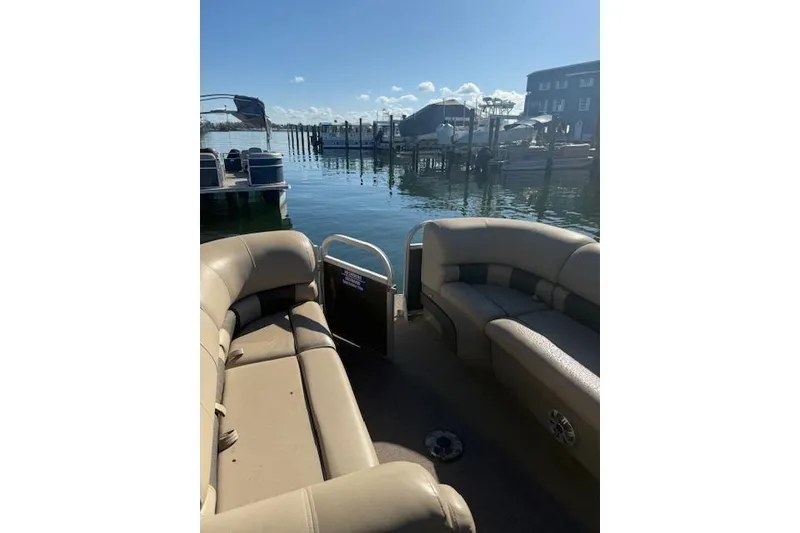 Slide: The Image of 2023 Sun Tracker Party Barge 22 DLX pontoon boat at a marina dock. - 51