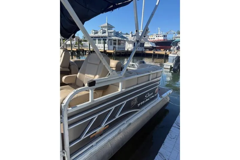 Slide: The Image of 2023 Sun Tracker Party Barge 22 DLX pontoon boat docked at marina. - 52
