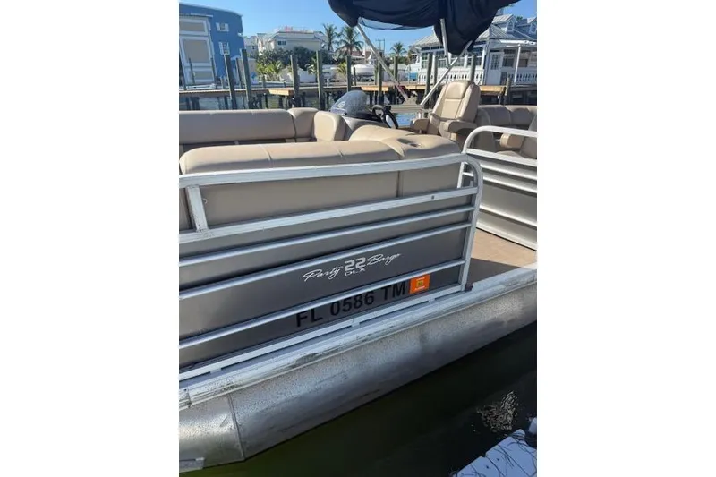 Slide: The Image of 2023 Sun Tracker Party Barge 22 DLX pontoon boat docked at marina. - 53