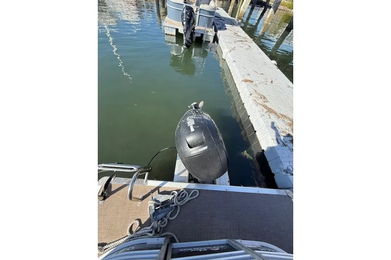 Slide: The Image of 2023 Sun Tracker Party Barge 22 DLX docked with Mercury outboard motor. - 57