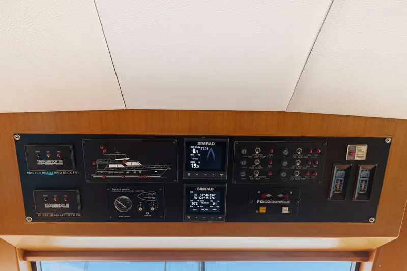 Slide: The Image of Control panel of a 1999 Symbol 558 yacht with navigation and monitoring systems. - 43