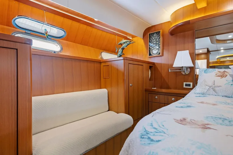Slide: The Image of Luxurious 1999 Symbol 558 yacht cabin with wooden interior and nautical-themed decor. - 49