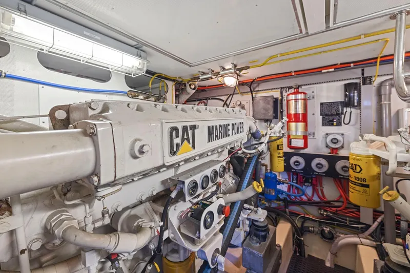 Slide: The Image of Engine room of a 1999 Symbol 558 yacht with CAT marine power engine. - 62