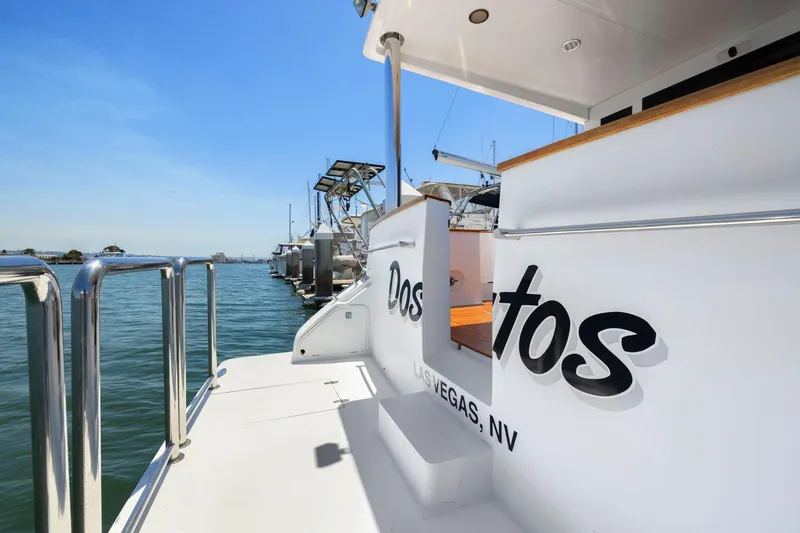 Slide: The Image of Luxury yacht docked at marina, clear blue sky, Symbol 558, 1999 model. - 7