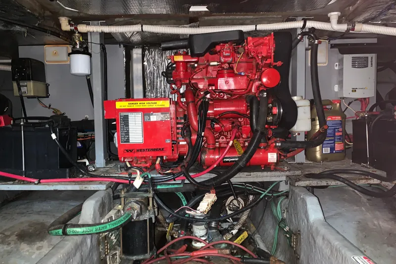Slide: The Image of Engine room of 2000 Sea Ray 400 Sedan Bridge with Westerbeke generator. - 18