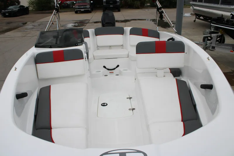 Slide: The Image of 2022 Tahoe T16 boat interior with white and gray seating, red accents. - 6