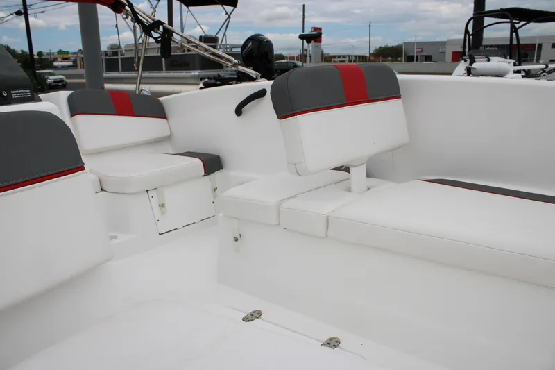 Slide: The Image of 2022 Tahoe T16 boat interior with white and gray seating, red accents. - 7