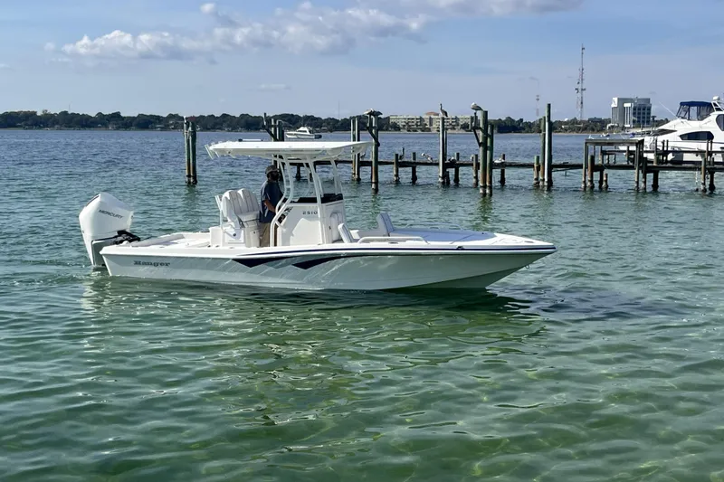 The Image of 2026 Ranger 2510 Bay boat in a showroom on a trailer. - 0