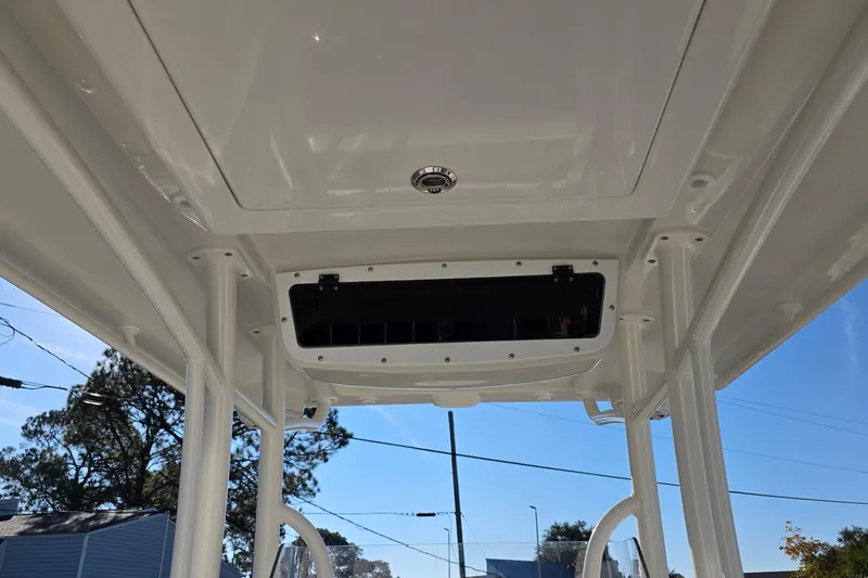 Slide: The Image of 2026 Ranger 2510 Bay boat interior storage compartment with wooden flooring. - 10