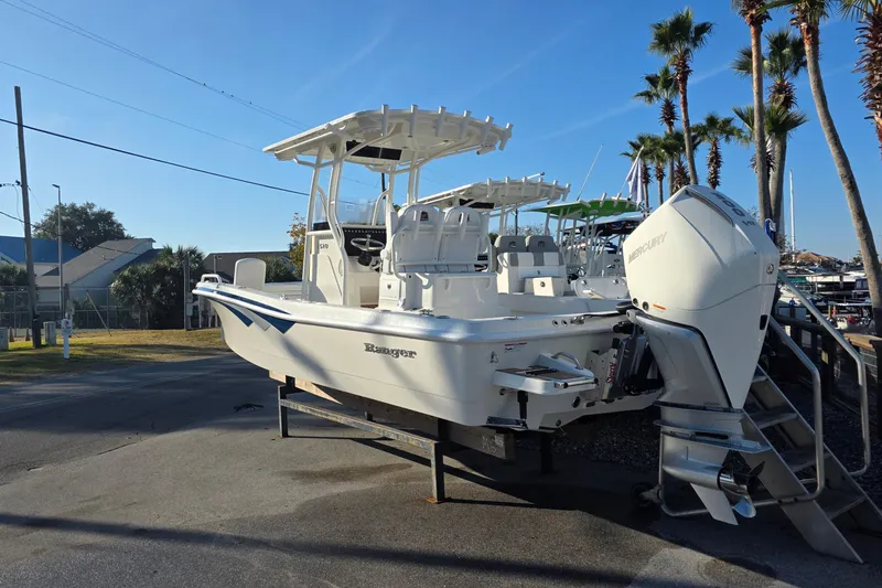 Slide: The Image of 2026 Ranger 2510 Bay boat with Mercury engine in showroom. - 2