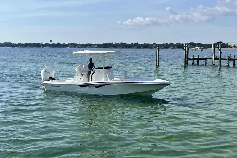 Slide: The Image of 2026 Ranger 2510 Bay boat on clear water near a dock. - 20