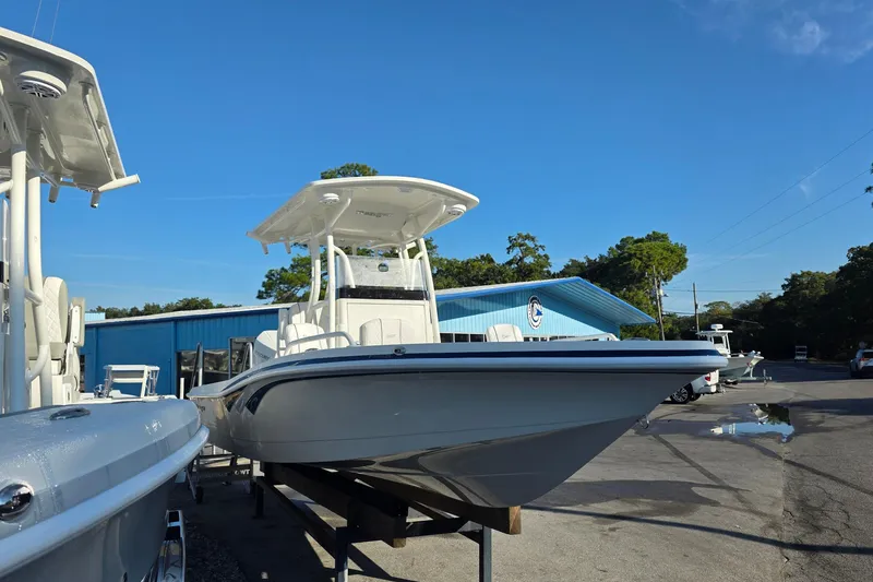 Slide: The Image of 2026 Ranger 2510 Bay boat on clear water near a dock. - 3