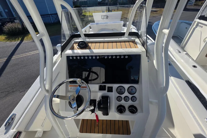 Slide: The Image of Open storage compartments on a 2026 Ranger 2510 Bay boat deck. - 9