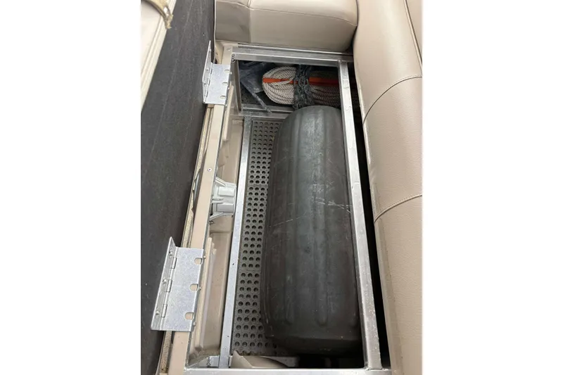 Slide: The Image of Under-seat storage compartment in a 2018 Avalon 2385 EL boat. - 16