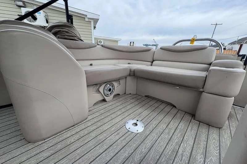 Slide: The Image of Luxurious seating on 2018 Avalon 2385 EL pontoon boat with sleek design and speaker system. - 21