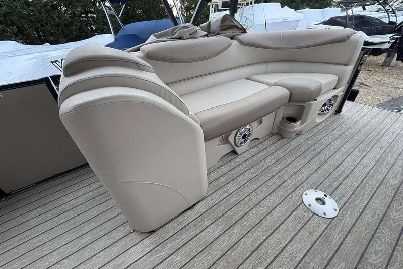 Slide: The Image of Luxurious seating on 2018 Avalon 2385 EL boat with integrated speakers and cup holders. - 22