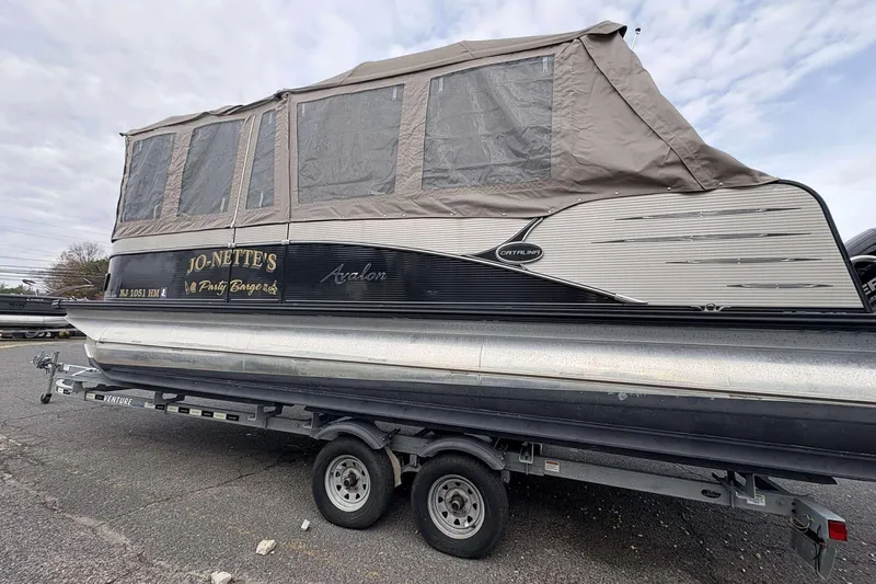 Slide: The Image of 2018 Avalon 2385 EL pontoon boat with canopy on trailer, side view. - 26