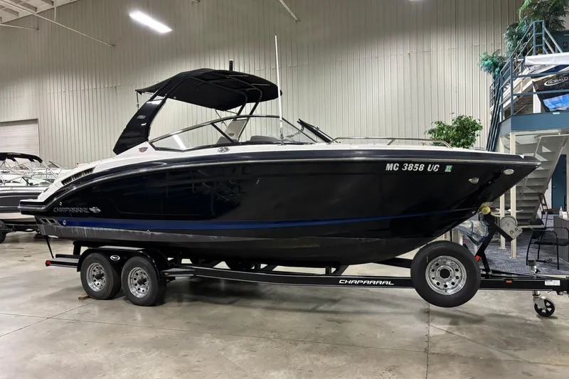 The Image of 2017 Chaparral 257 SSX boat on trailer in indoor showroom. - 0