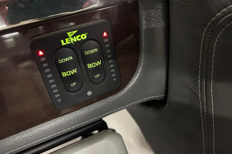 Slide: The Image of Lenco trim tab control panel on 2017 Chaparral 257 SSX boat dashboard. - 10