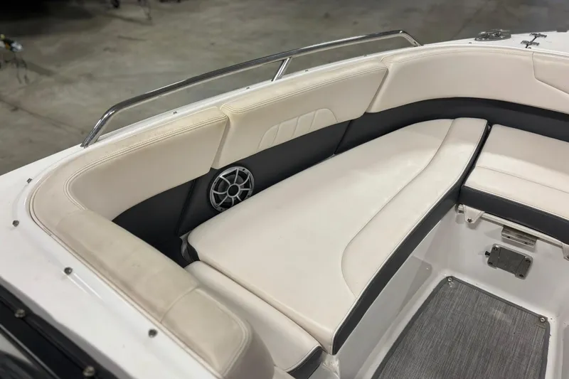 Slide: The Image of 2017 Chaparral 257 SSX boat interior with white cushioned seating and speaker. - 14