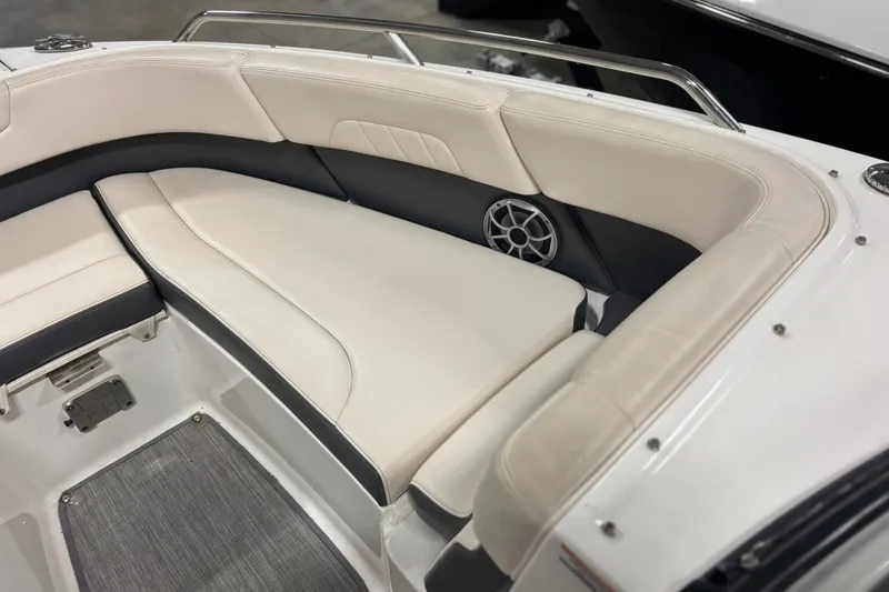 Slide: The Image of 2017 Chaparral 257 SSX boat interior with cushioned seating and speaker. - 15