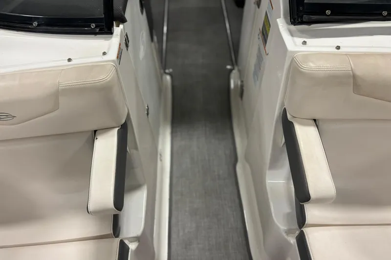 Slide: The Image of 2017 Chaparral 257 SSX boat interior with white seating and sleek design. - 16