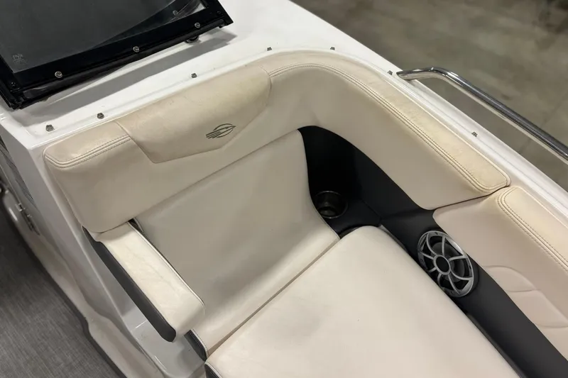 Slide: The Image of 2017 Chaparral 257 SSX boat interior with beige seating and speaker detail. - 17