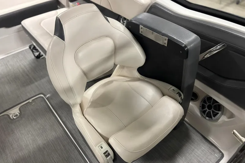Slide: The Image of 2017 Chaparral 257 SSX boat interior with white leather seat and speaker. - 19