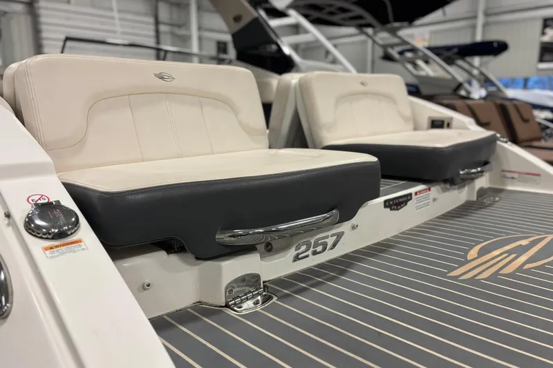 Slide: The Image of 2017 Chaparral 257 SSX boat interior with cushioned seating and sleek design. - 2