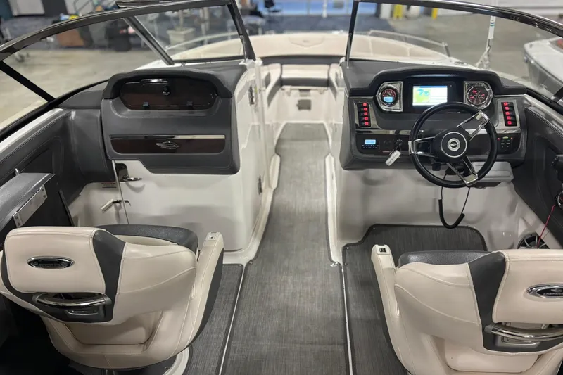 Slide: The Image of 2017 Chaparral 257 SSX boat interior with modern dashboard and seating. - 26