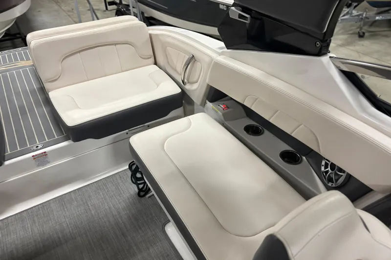 Slide: The Image of 2017 Chaparral 257 SSX boat interior with white seating and cup holders. - 29