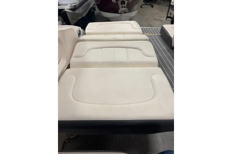 Slide: The Image of 2017 Chaparral 257 SSX boat interior with white cushioned seating. - 32