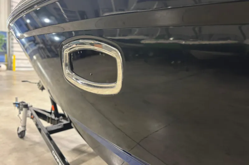 Slide: The Image of 2017 Chaparral 257 SSX boat detail in a showroom, highlighting sleek design and craftsmanship. - 35
