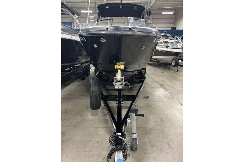 Slide: The Image of 2017 Chaparral 257 SSX boat on trailer in showroom. - 37
