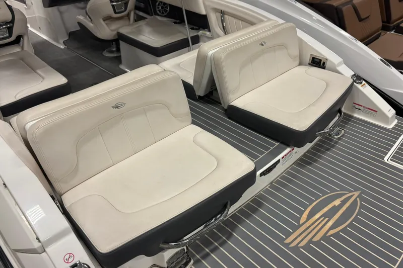 Slide: The Image of 2017 Chaparral 257 SSX boat interior with beige seating and sleek design. - 4