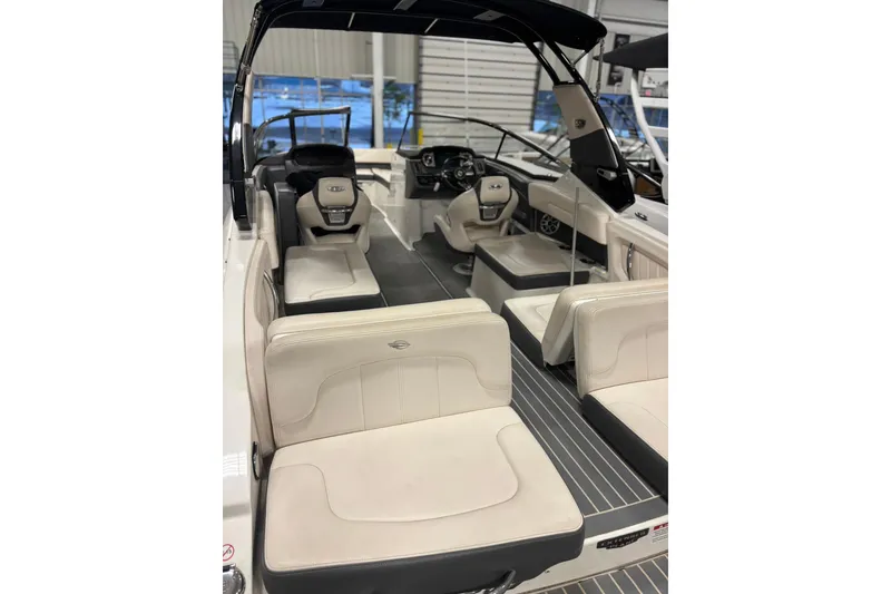 Slide: The Image of 2017 Chaparral 257 SSX boat interior with luxurious seating and modern dashboard. - 6