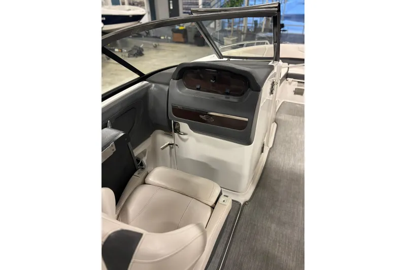 Slide: The Image of 2017 Chaparral 257 SSX boat interior with helm and seating area. - 8