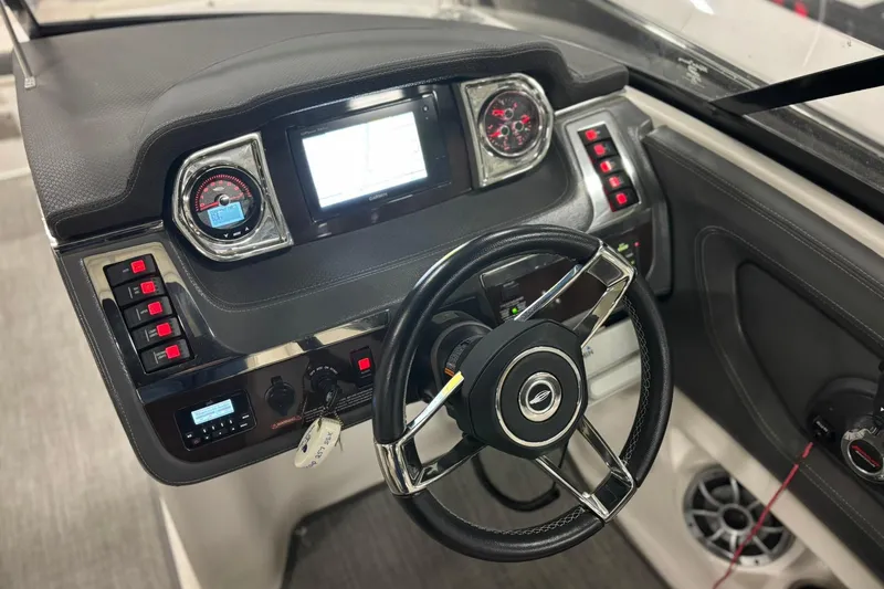Slide: The Image of Dashboard of 2017 Chaparral 257 SSX boat with steering wheel and control panel. - 9