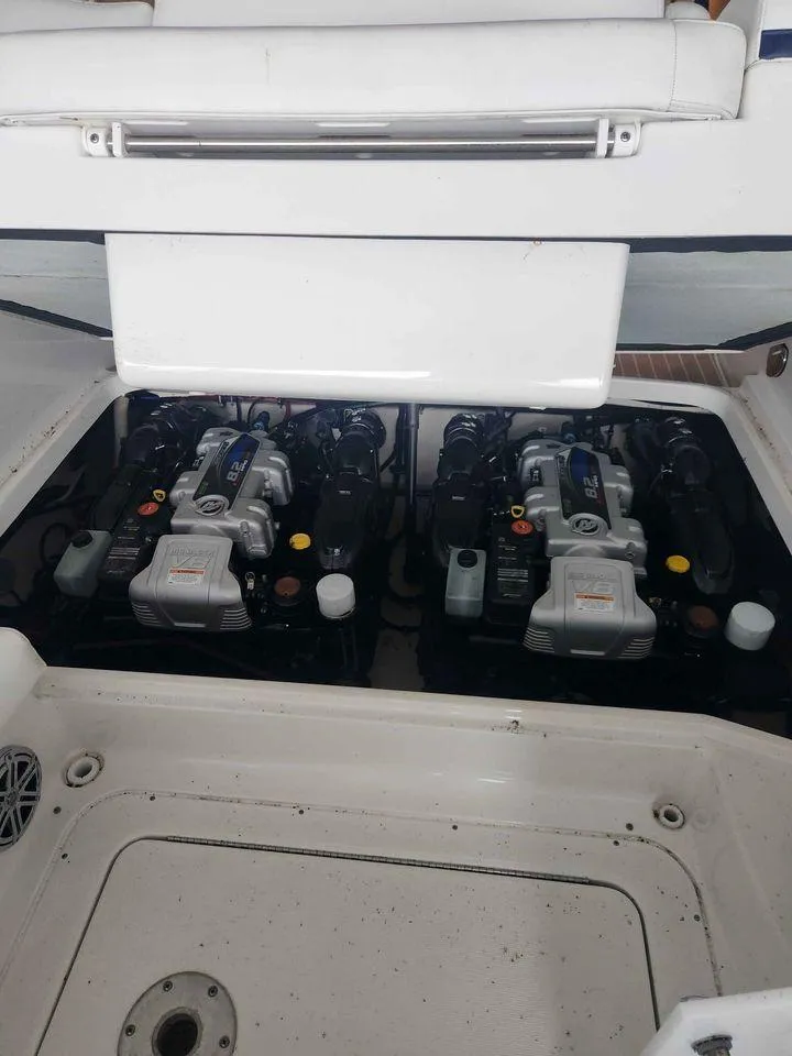 Slide: The Image of 2018 Formula 310 Sun Sport boat engine compartment with twin engines. - 11