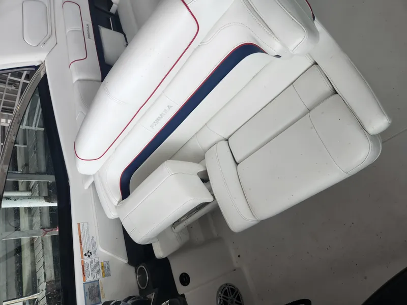 Slide: The Image of 2018 Formula 310 Sun Sport boat interior with white leather seating. - 21