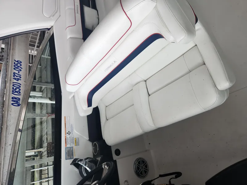 Slide: The Image of 2018 Formula 310 Sun Sport boat interior with white seating and blue accents. - 22