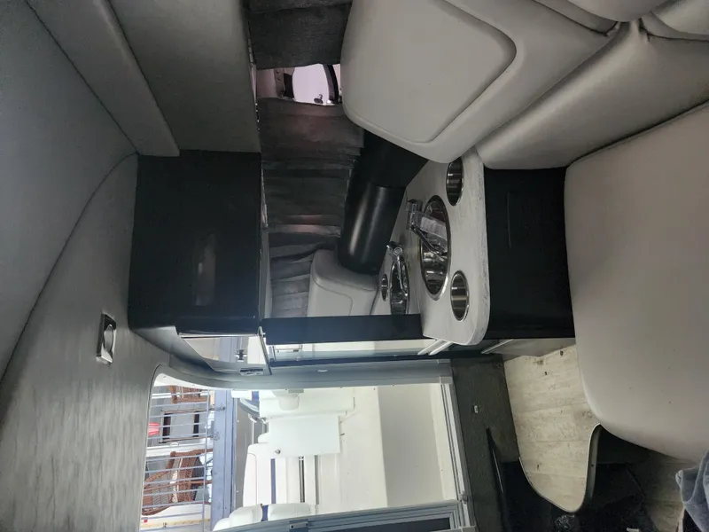 Slide: The Image of Interior of 2018 Formula 310 Sun Sport boat with seating and cup holders. - 28