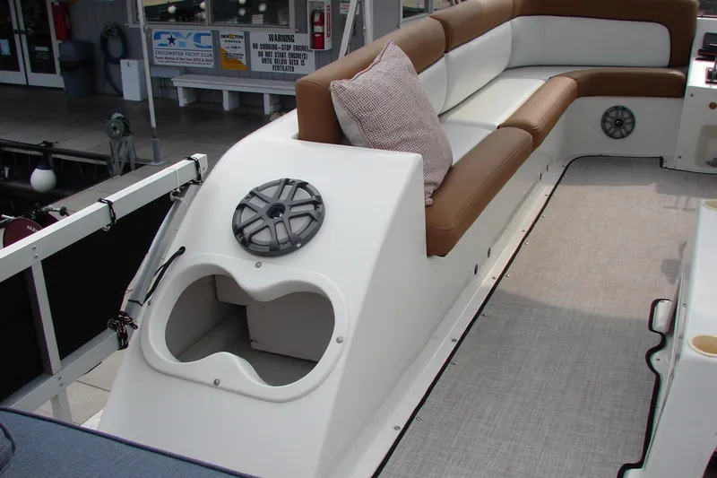 Slide: The Image of 1997 Gibson 47 Sport Houseboat interior with cushioned seating and speaker system. - 30