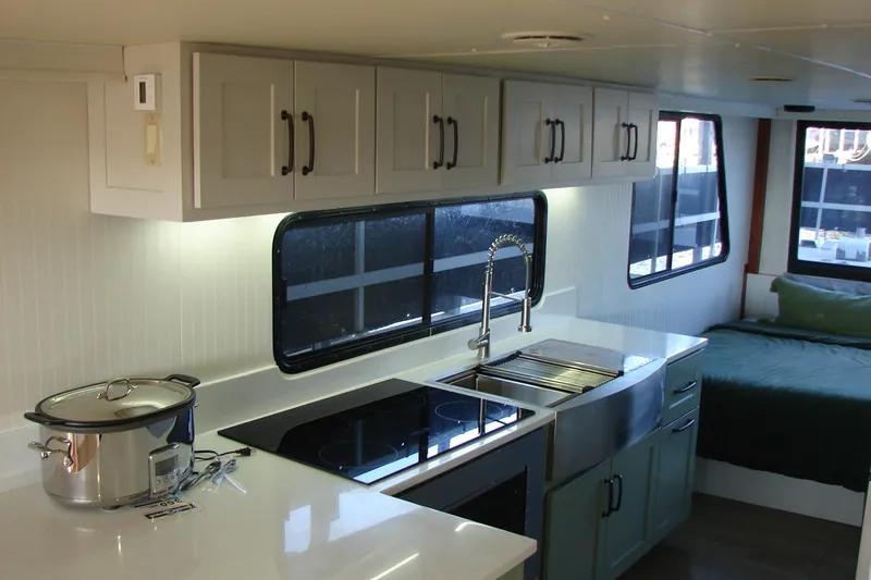 Slide: The Image of Modern kitchen interior of 1997 Gibson 47 Sport Houseboat with sleek cabinetry and appliances. - 77