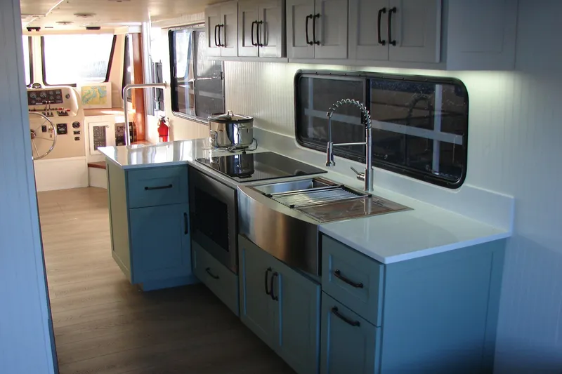 Slide: The Image of Modern kitchen interior on 1997 Gibson 47 Sport Houseboat with sleek cabinetry and appliances. - 78