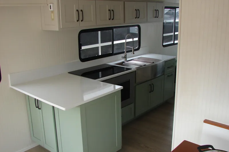 Slide: The Image of Modern kitchen interior of 1997 Gibson 47 Sport Houseboat with sleek countertops and cabinetry. - 83
